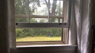 A close up of an open window.