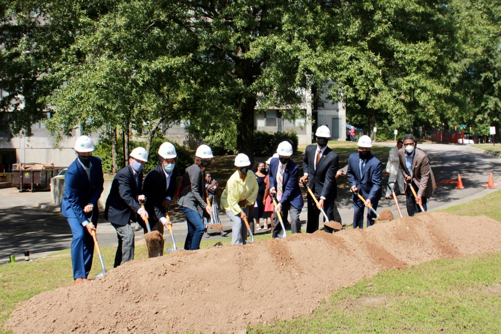 DHA Staff and NC Public Officials stand with shovels at the JJ Henderson Groundbreaking Ceremony.