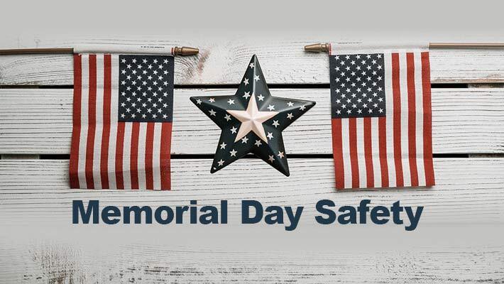 Memorial Day Safety. Two American flags with a star between them.