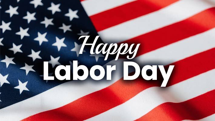 Happy Labor Day. An American flag blowing in the wind.