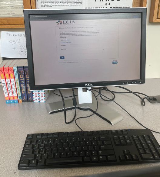 A computer monitor that has the DHA online portal to pay rent open.