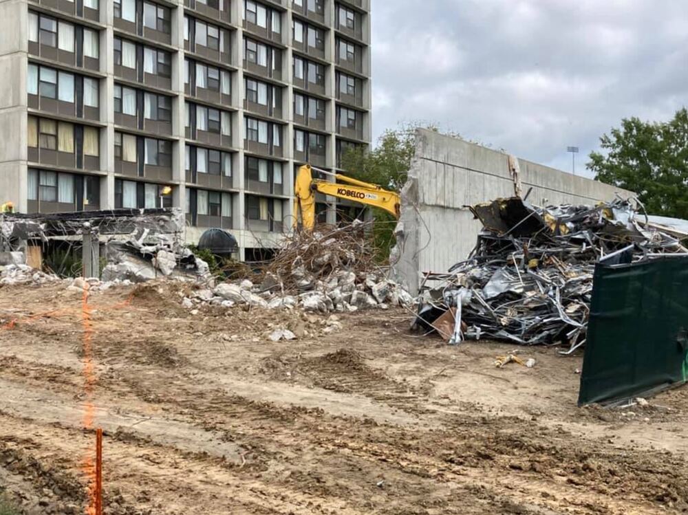 heavy equipment tearing down old building