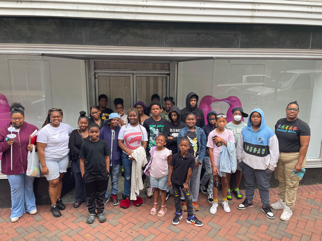 A group of kids standing together for a photo.