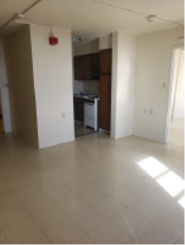 Clean and empty kitchen/dining area. 