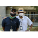 One masked man and one unmasked man.