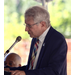 man at podium speaking 