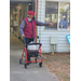 Woman walking outside with a walker