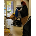 Woman with bags next to table with food