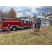 Firefighters watering a tree