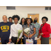 people standing in a group holding flowers