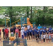 A group of people standing at a park