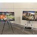 Two paintings sitting on easels 