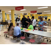 Police officers gathered around a table helping with redevelopment planning.