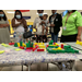 A diagram of redevelopment planning with a group of individuals gathered around a table.