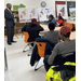 Individuals listening to a presentation.