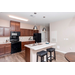 A kitchen with an island in the middle of the room.