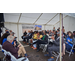 A group of individuals listening to a speech.