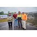 Four individuals wearing hard hats.