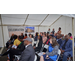 A group of people listening to a speaker.