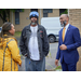 The executive director speaking with two individuals.