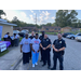 Police officers standing next to two women.