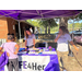 Women standing behind a table that reads: LIFE4HER.