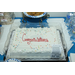 A cake with the word congratulations written on it.