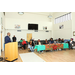 A man speaking behind a podium to the audience.