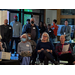 Audience members standing by the entrance.