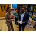 A woman and a man in a suit having a conversation.