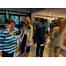 Large group of people standing by the front entrance.