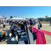 Individuals lining up at a table signing in.