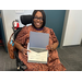  Sheritha Dash smiling while holding her award. 