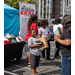  A little boy smiling while holding a box with new shoes. 