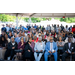  An audience listening to a speaker on stage. 